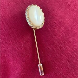 Vintage stick pin with an iridescent oval cobochon  with end cap.  From Europe